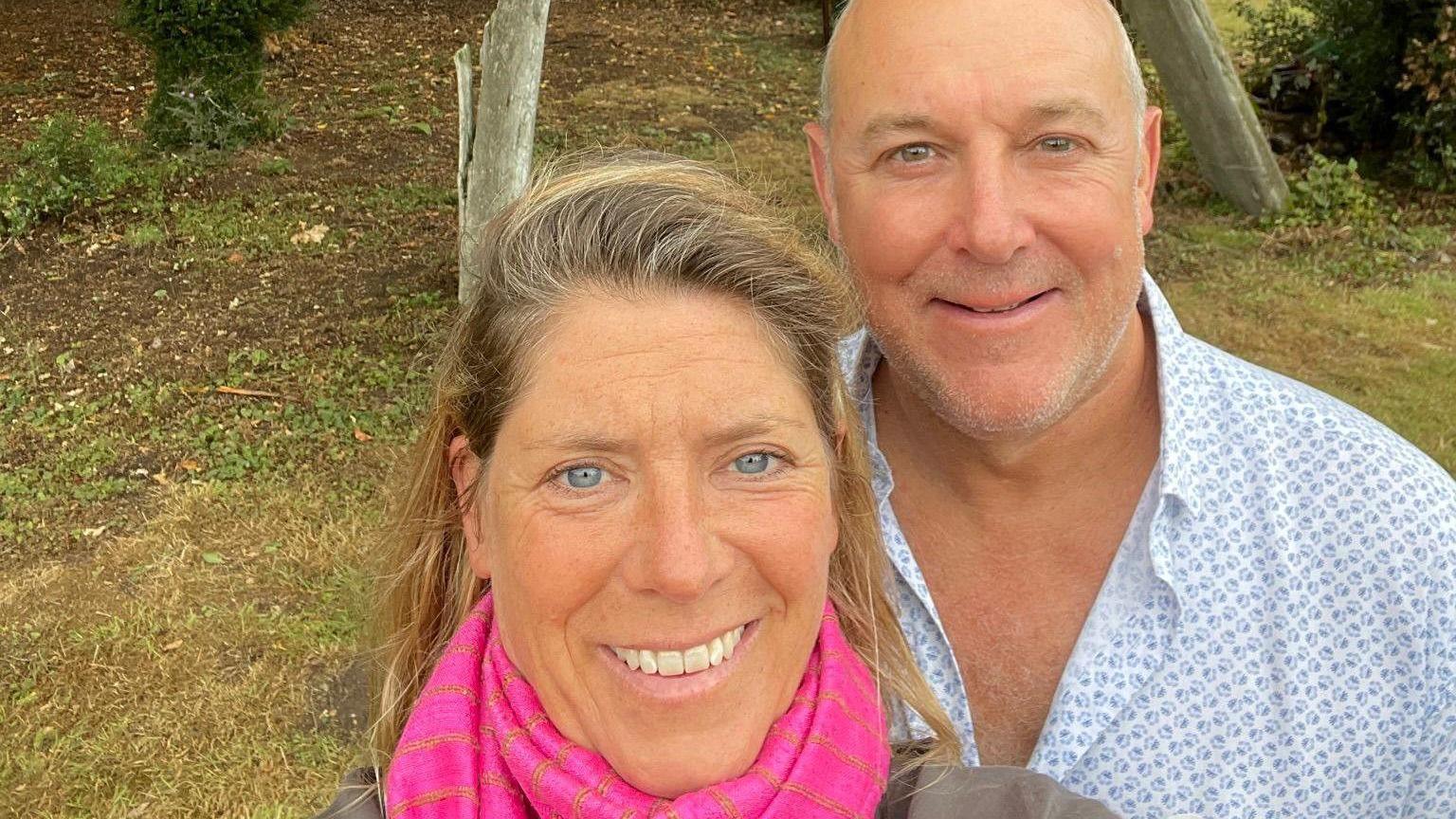 Victoria and Graham Bray smiling in a garden