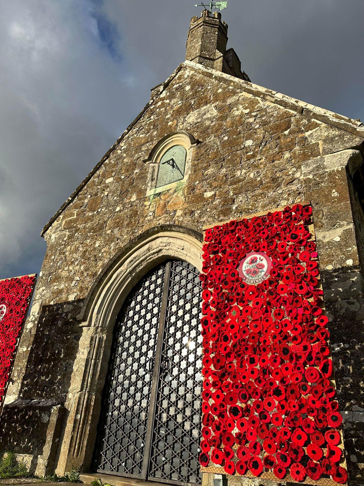 Church with poppies surrounding the door 