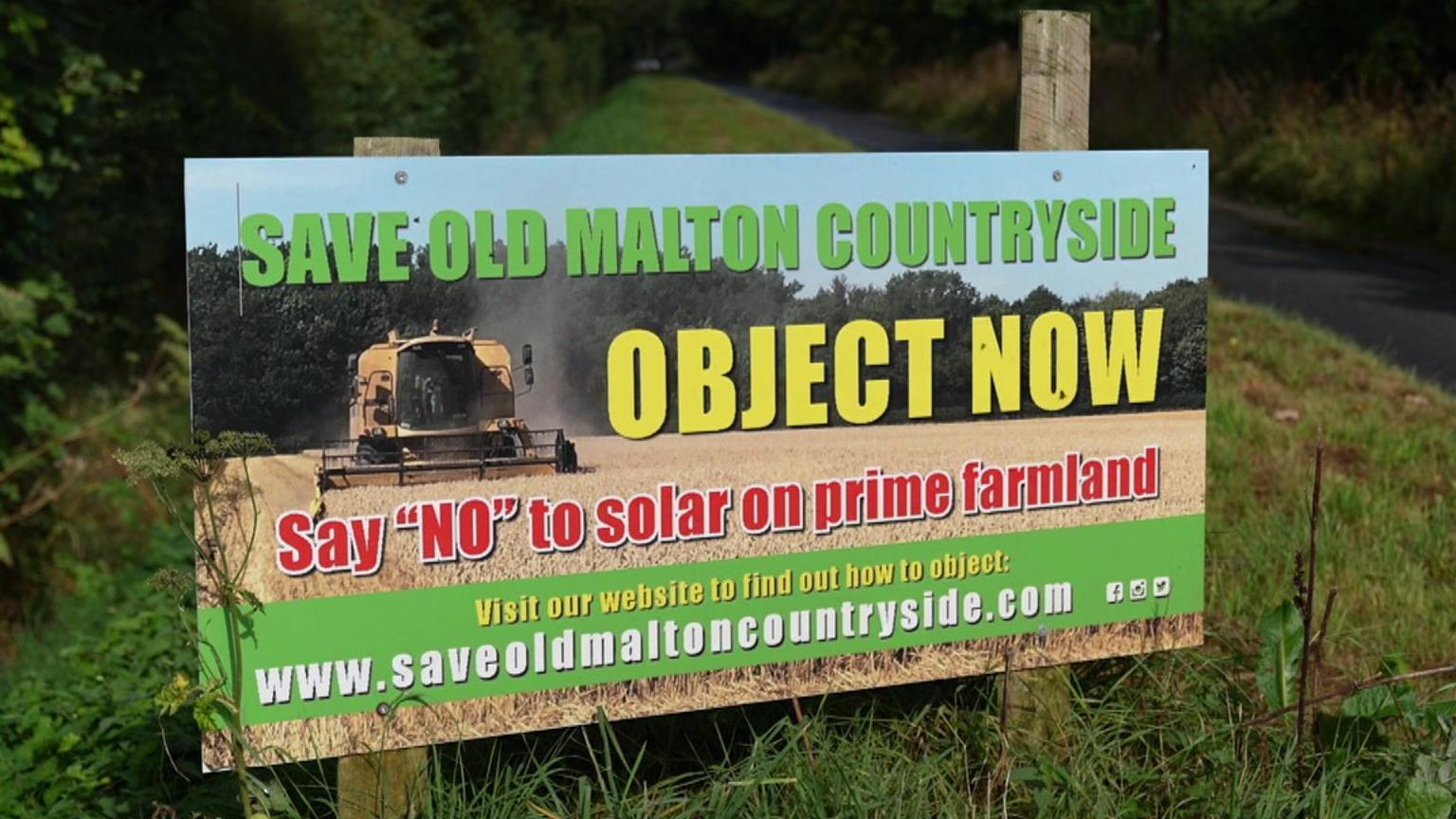 Campaign sign against the development reading "Save Old Malton countryside".