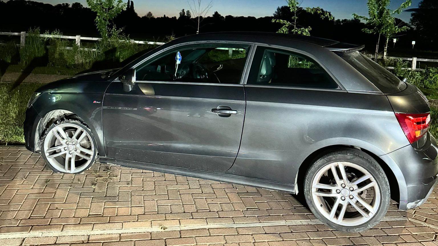 An Audi car parked on a residential road