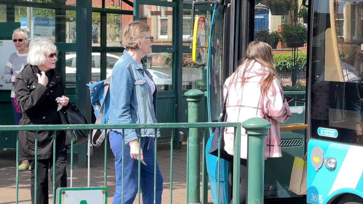 Passengers boarding bus