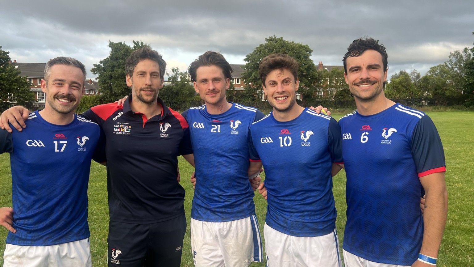 Four French GAA players on the pitch after their match