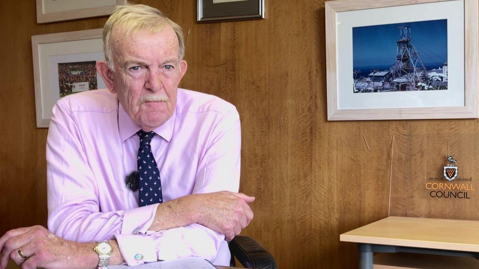 Man sitting behind desk