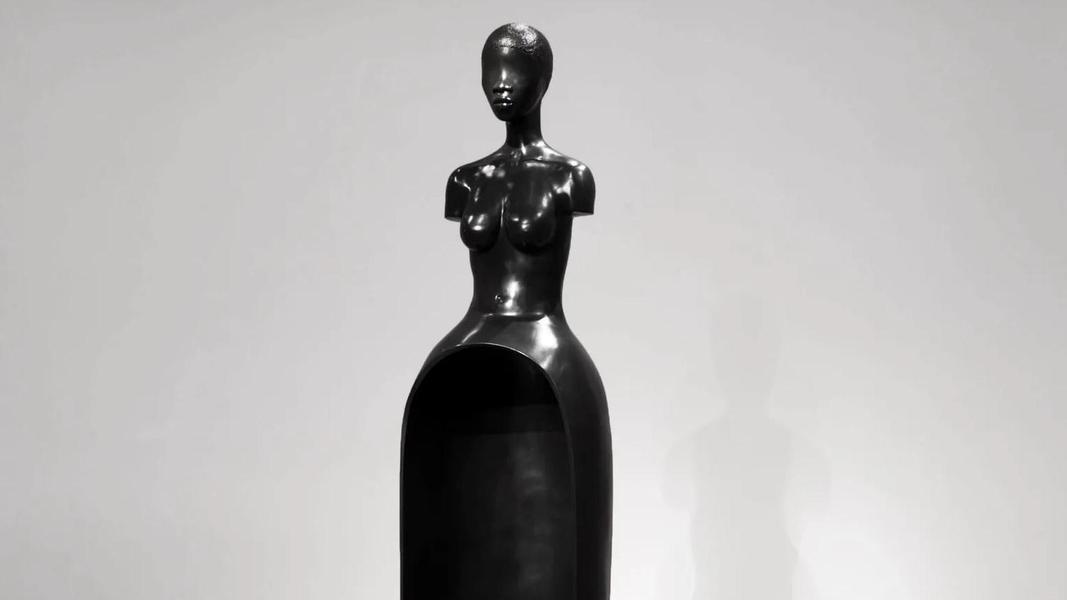 A black sculpture of a female torso by Simone Leigh