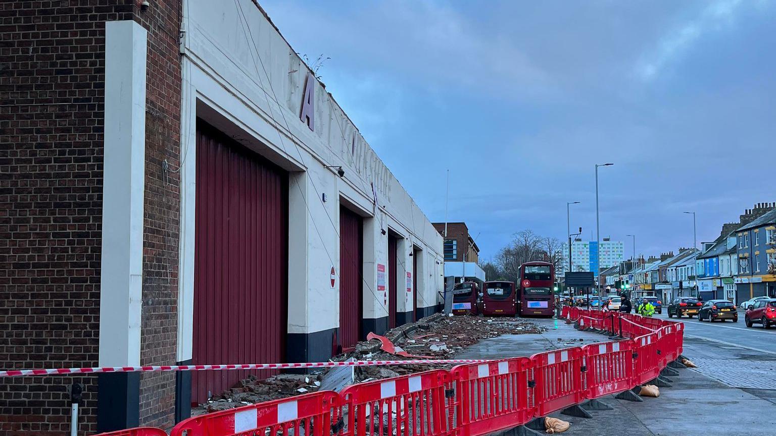 Rubble lined along a bus depot