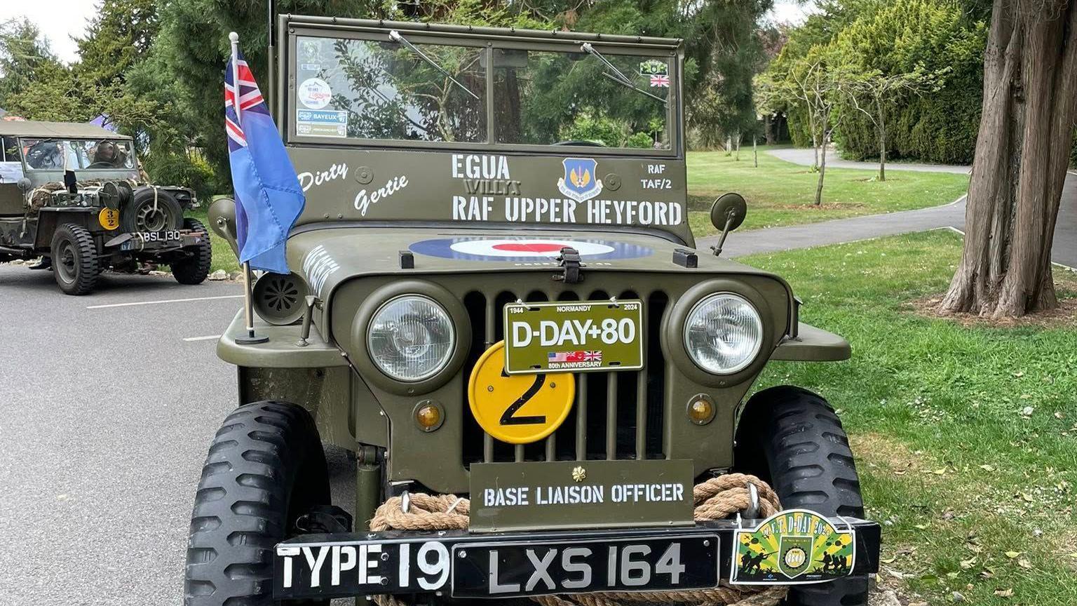 Two jeep-style World War Two-era military vehicles