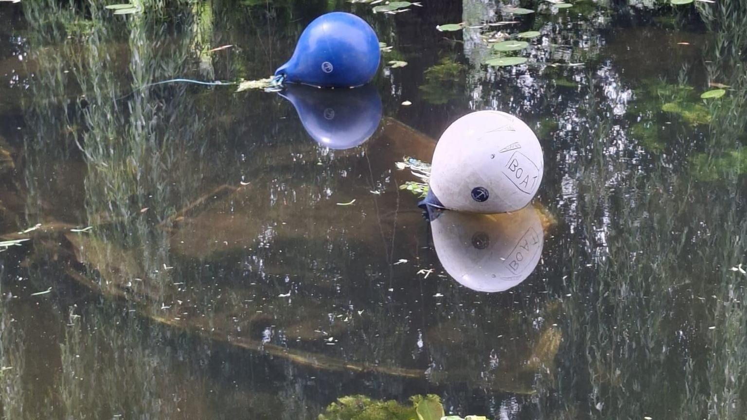 Abandoned boat sunk under the water's surface