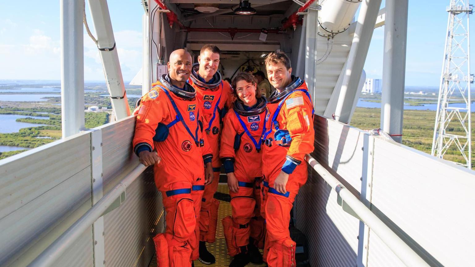 Artemis II moon mission astronauts pose on bridge.