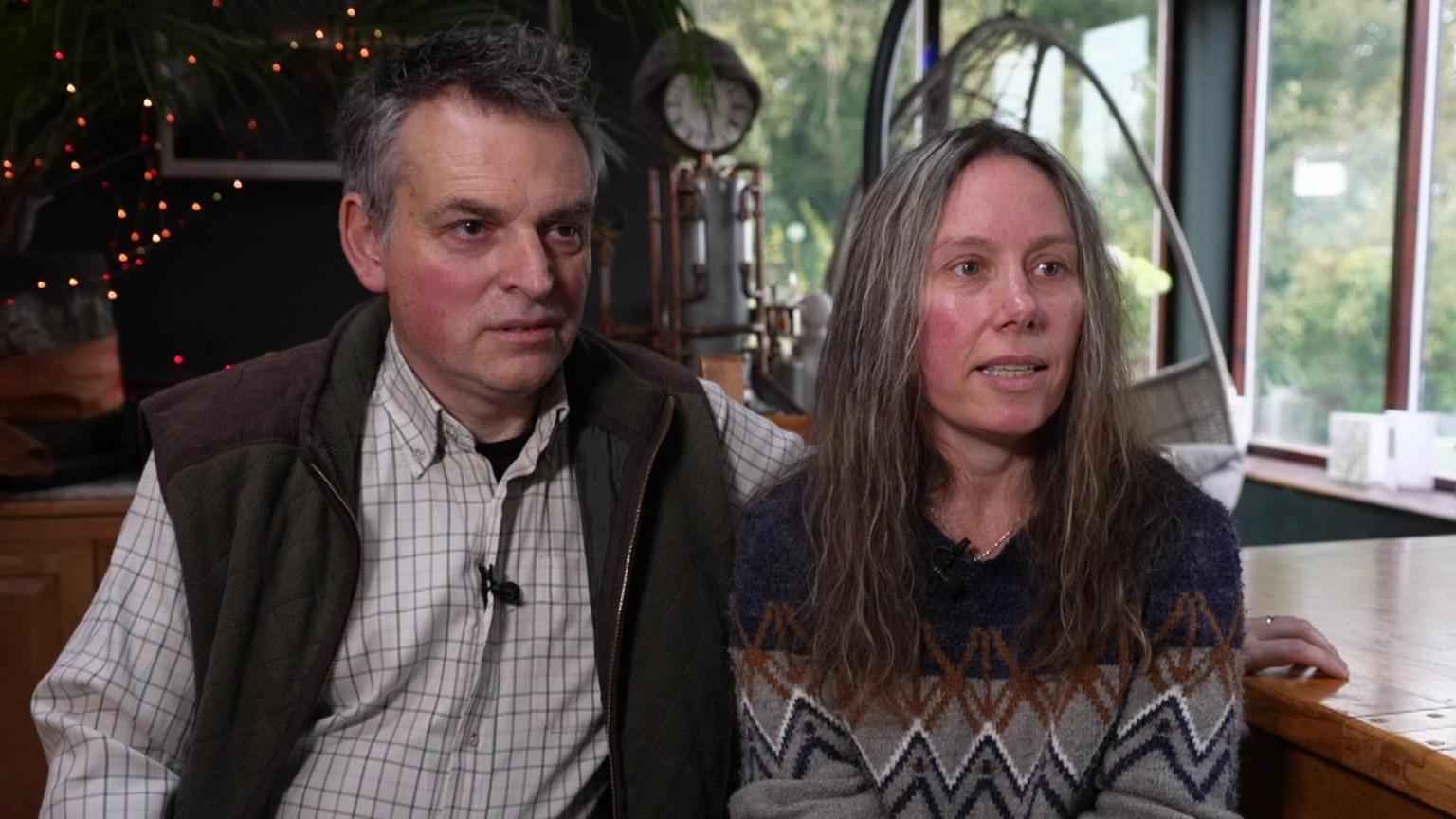 Callum Tindal-Draper's parents Steven Draper and Caroline Tindal sat on chairs in their home.