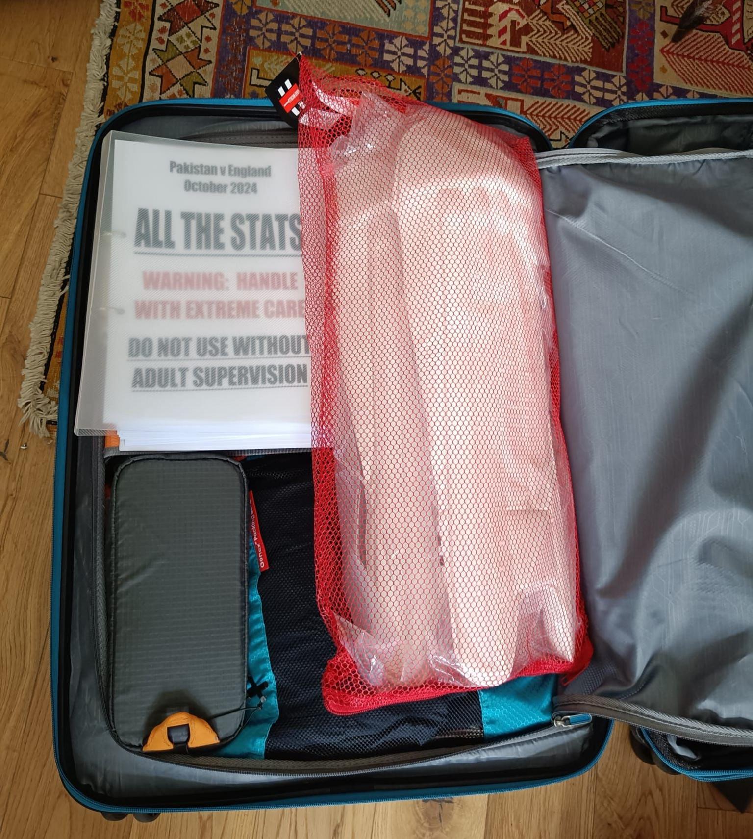 Andy Zaltzman's suitcase containing Jamie Smith's wicketkeeping pads