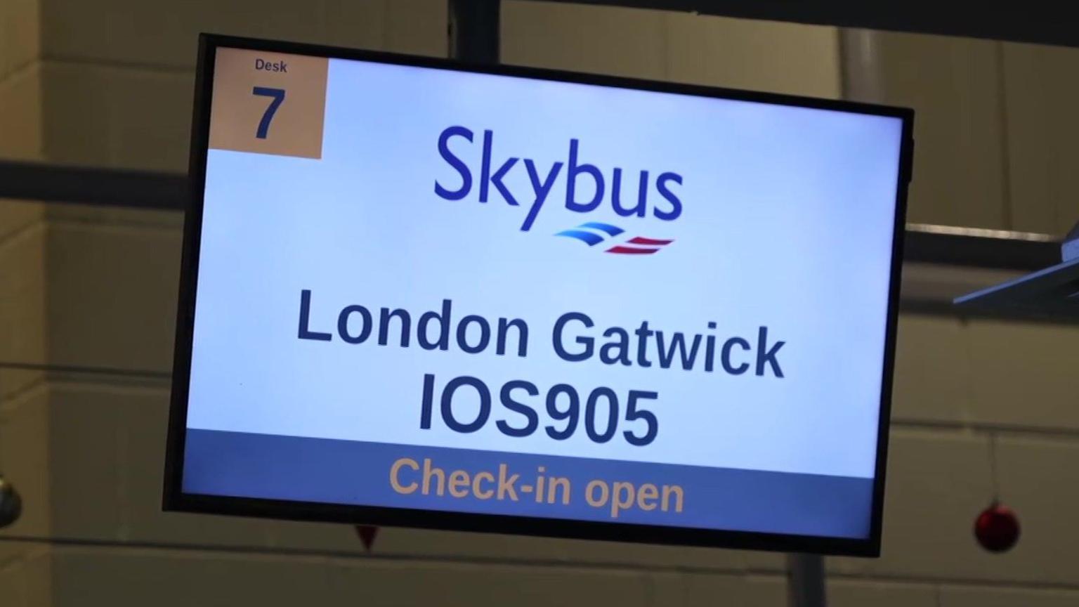 A screen in Newquay Airport showing details for a Skybus flight to London Gatwick.