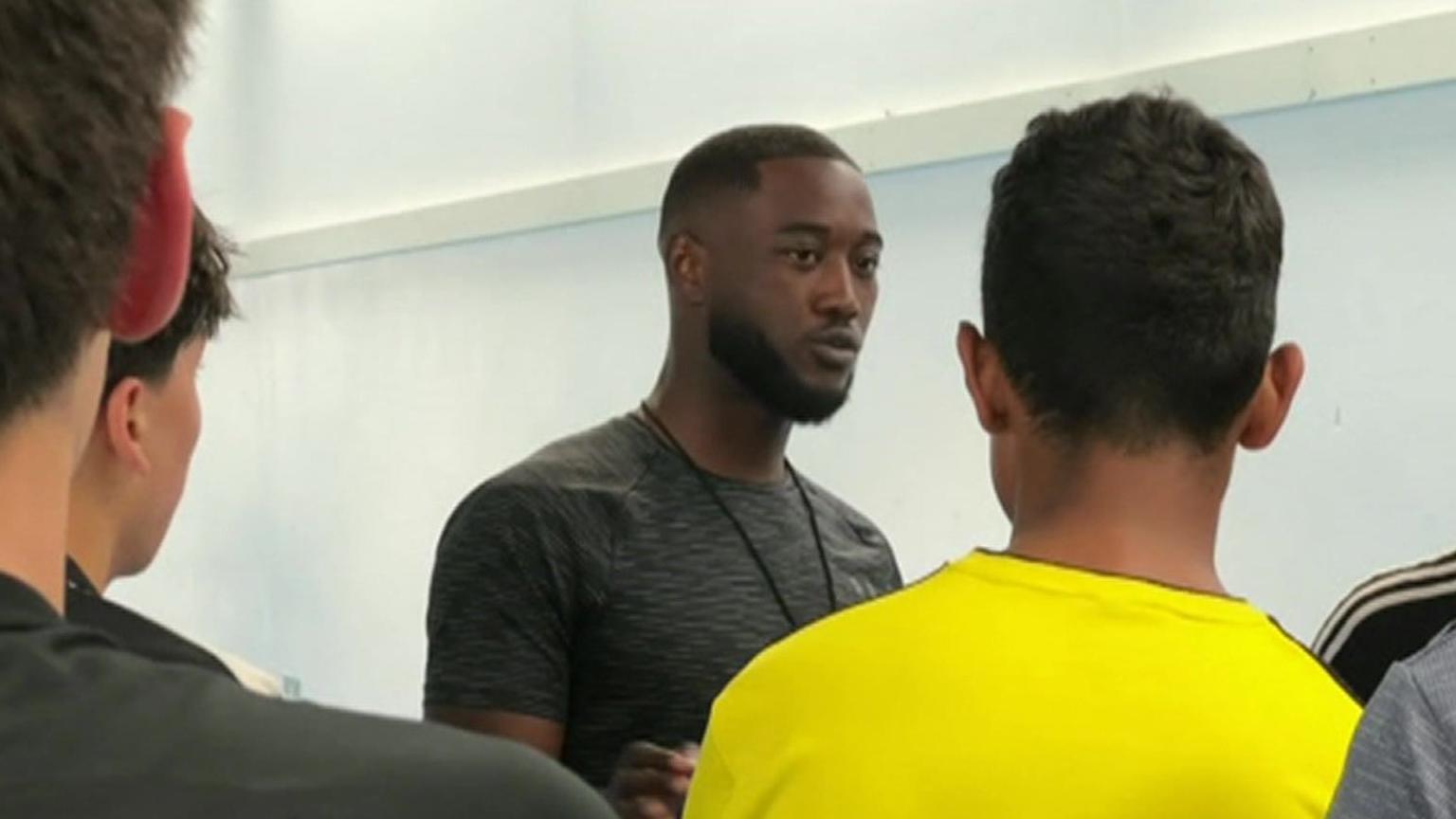 Otis Lawson coaching a group of young people