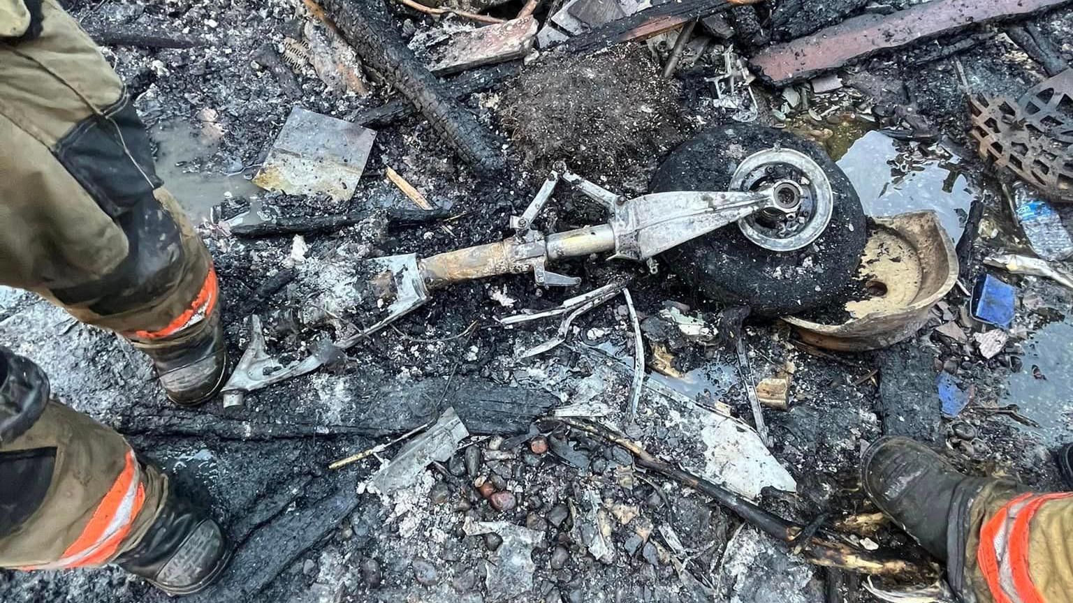 A photo shared by the Gresham Fire department appears to show a plane's wheel among the debris