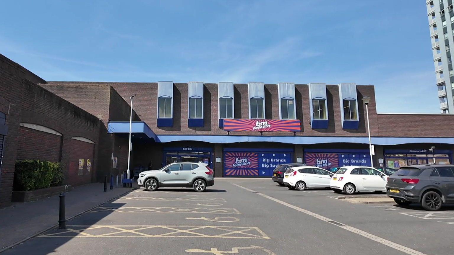 B&M car park. There are five cars parked outside