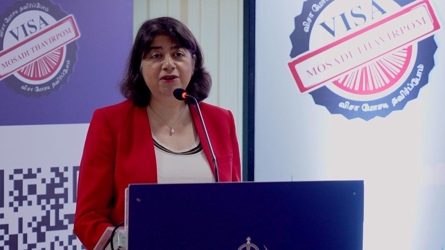 The UK’s Indo-Pacific Minister Seema Malhotra, wearing a red blazer, speaking at a visa awareness campaign event in India's Chennai city on 22 November.