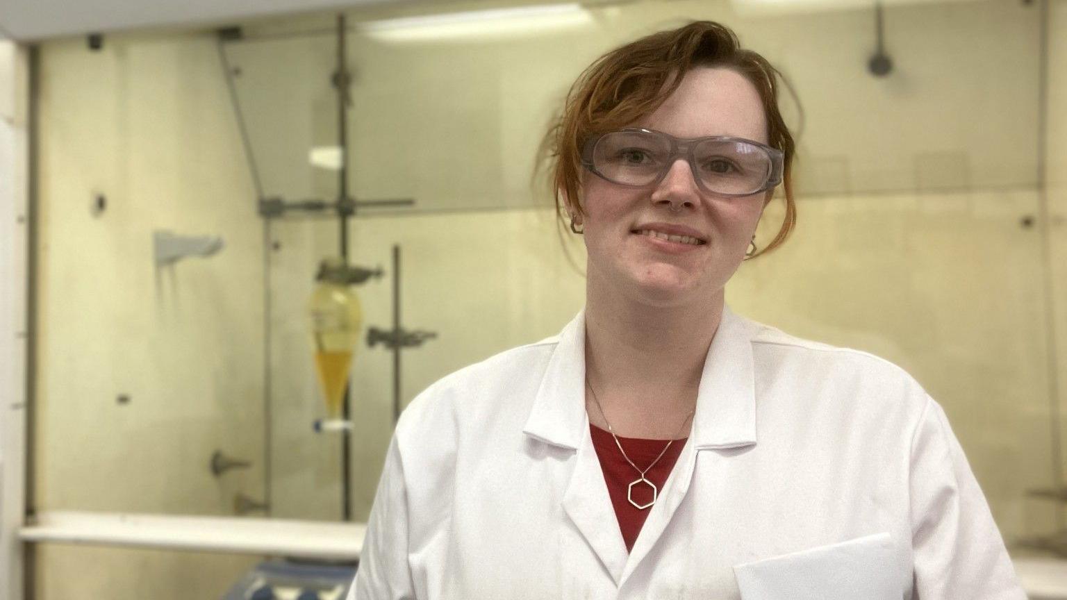 Sophie Greaves, a research chemist based in Liverpool, stood in a lab wearing a white lab coat and Googles