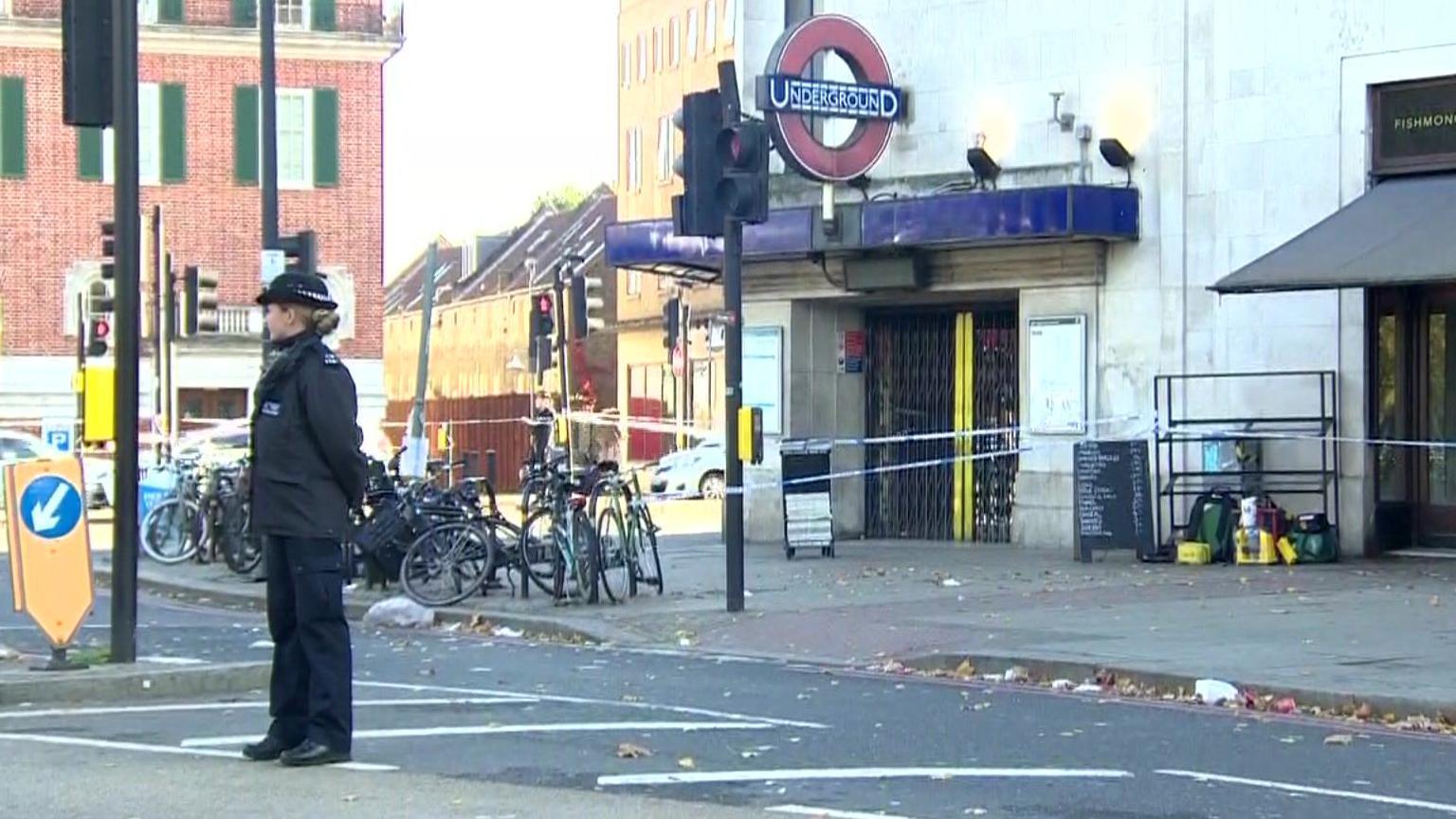 A police officer outside Clapham South Tube station 