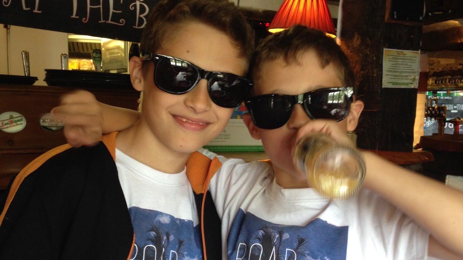 Jack and Ben wearing sunglasses and having fun when they were younger.