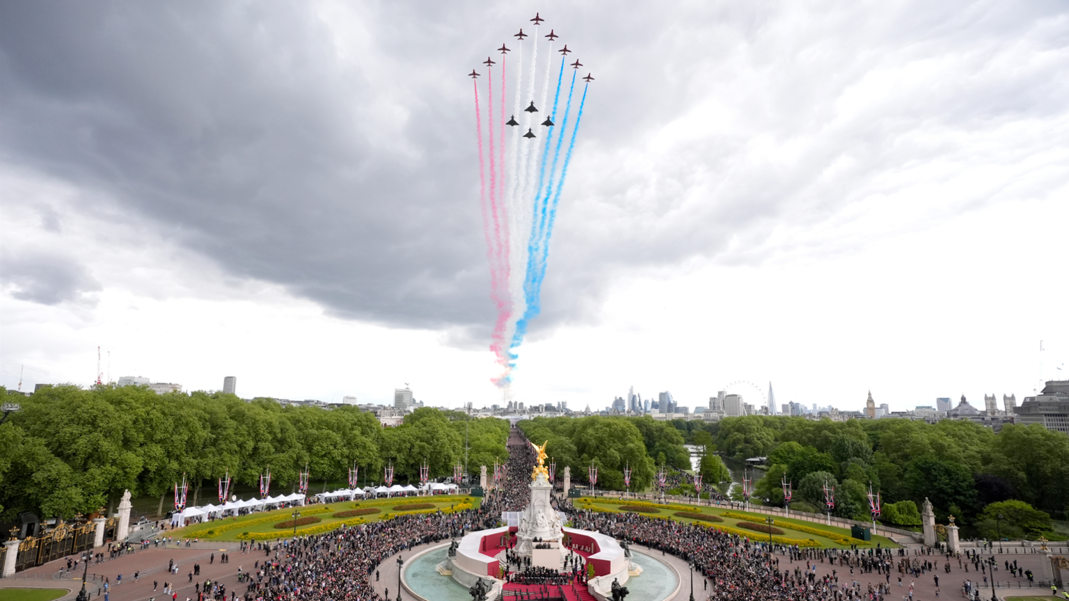 The military fly past passes over The Mall and Buckingham Palac