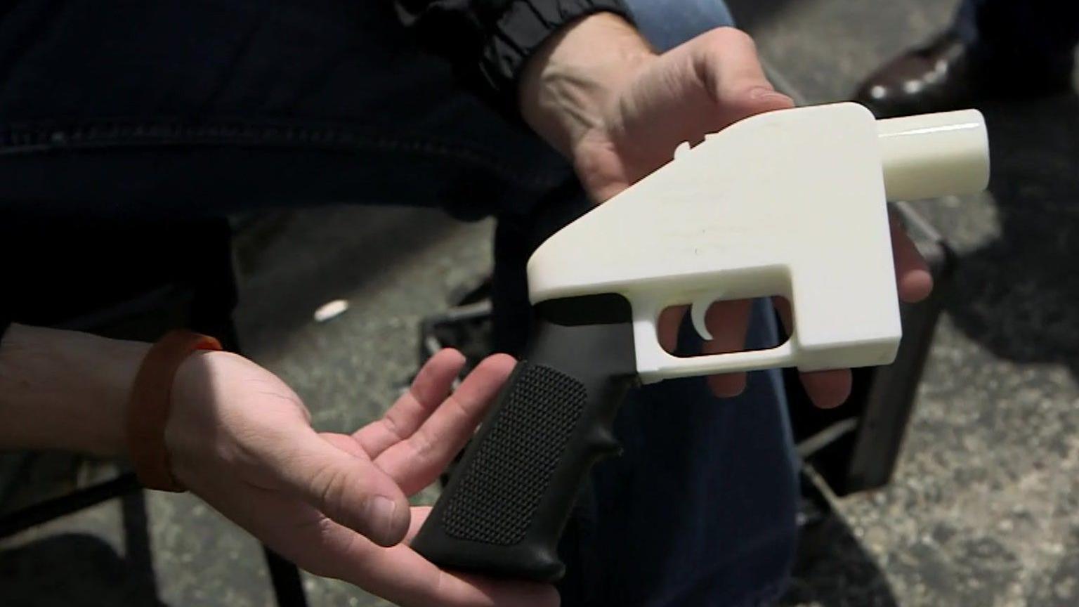 Cody Wilson (unseen) displays the first operational porotype of a 3D printed gun