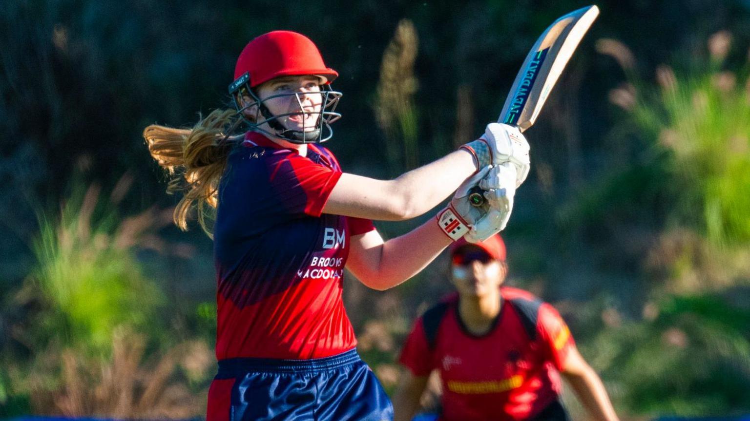 Jersey's Analise Merritt sends a shot towards the boundary against Gibraltar