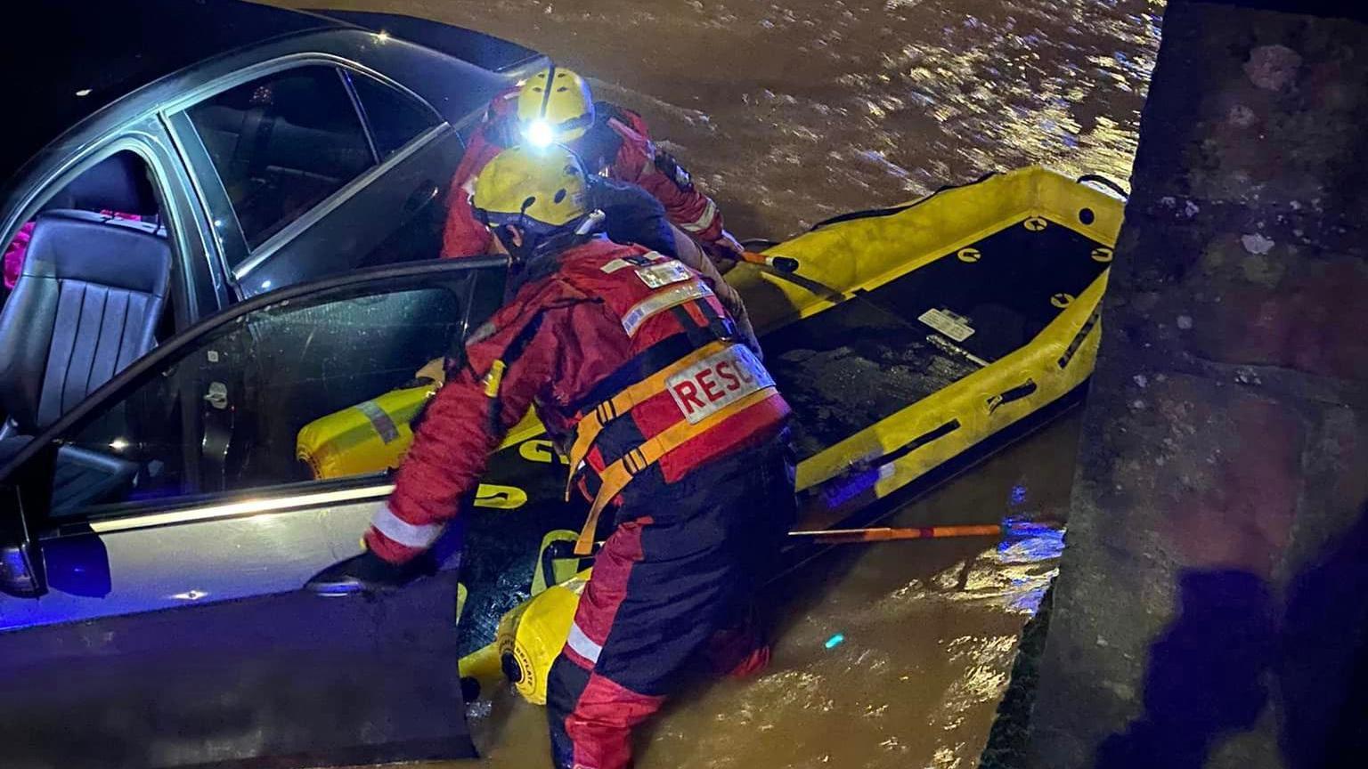 Firefighters rescuing people from the car in Kenilworth