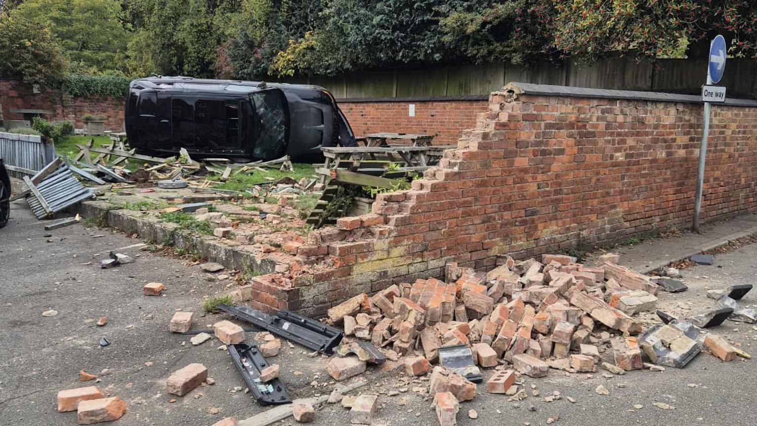 Range Rover toppled on its side after crashing into pub beer garden