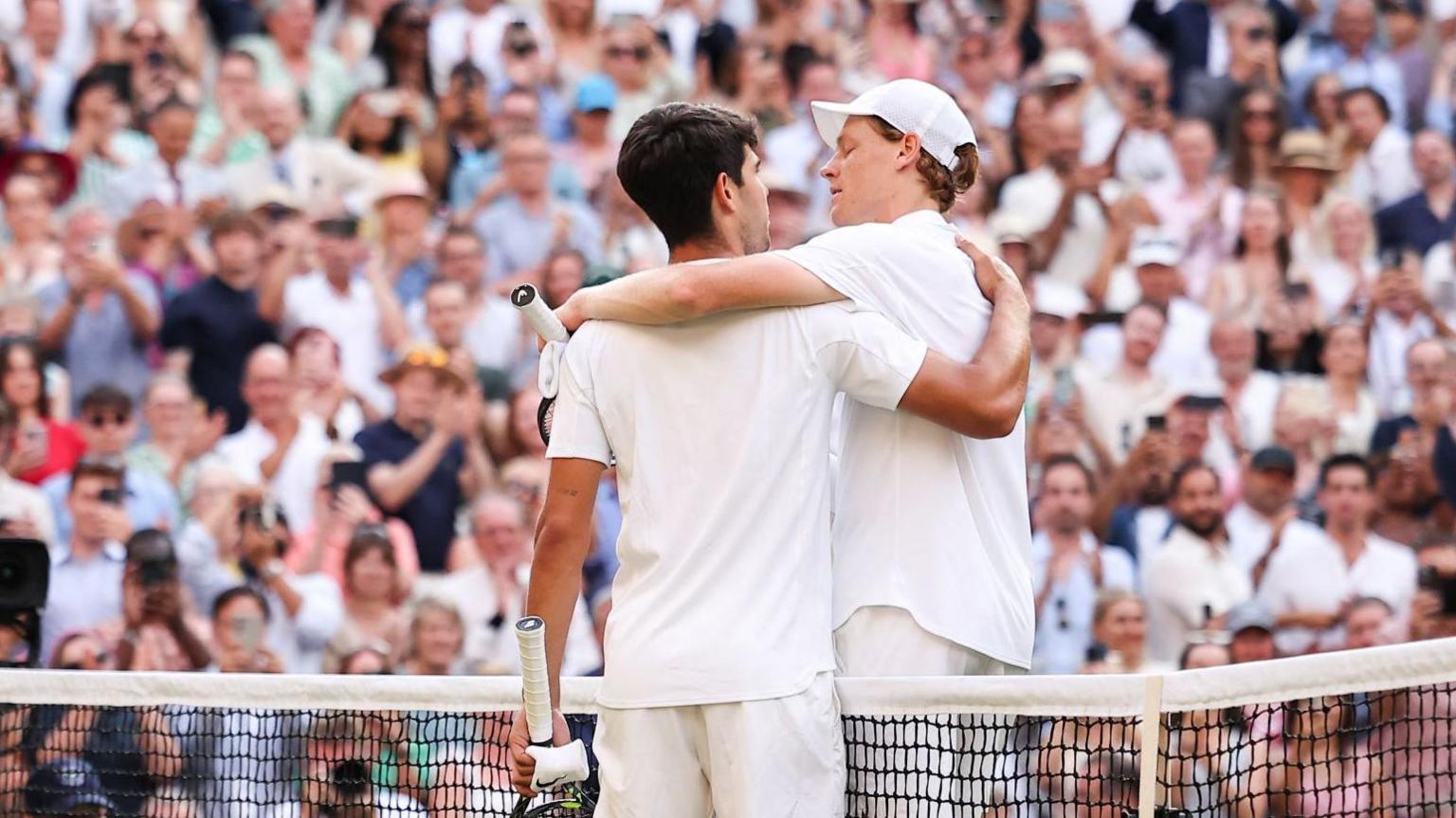 Carlos Alcaraz and Jannik Sinner share a warm hug at the net