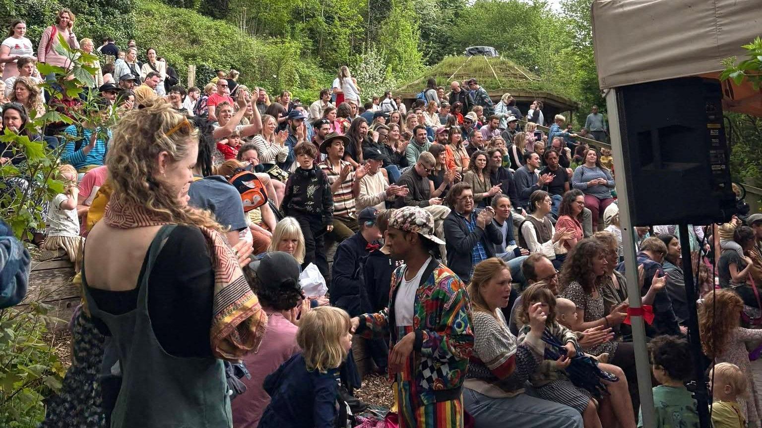 Hundreds of people are seen packed into St Werburgh's City Farm in Bristol during an open day. Many of them are families with children