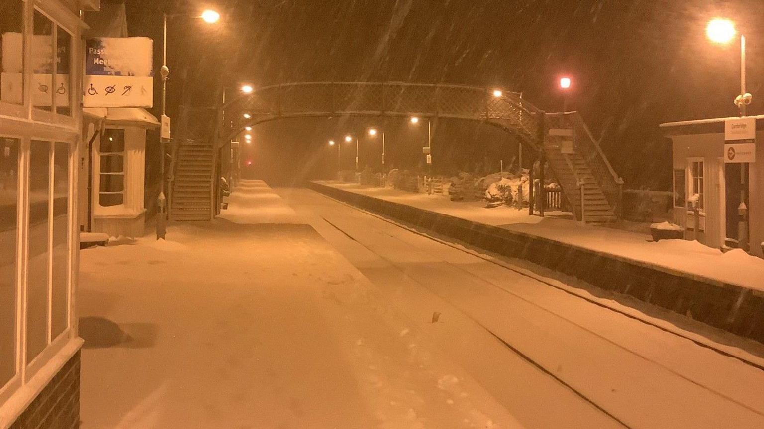 A train station covered in snow