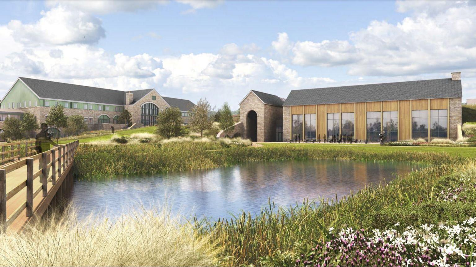 A CGI image of part of the planned campus. There is a pond and a bridge leading to the campus, which consists of brick houses with big glass windows.