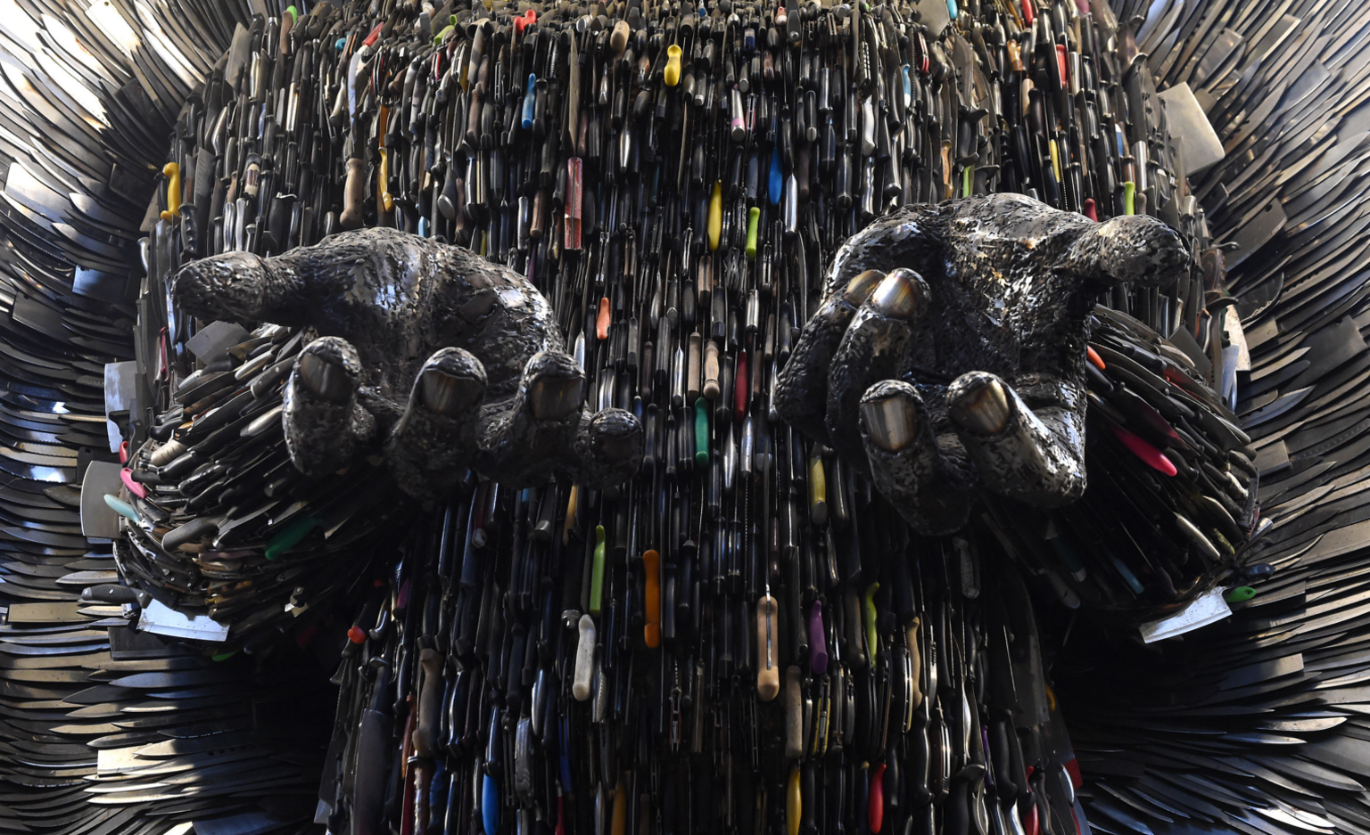 Close up detail of the hands of the Knife Angel sculpture, showing the knives used to create it. The Knife Angel is made up of 100,000 knifes, collected by 41 police forces across the country through amnesties and confiscations