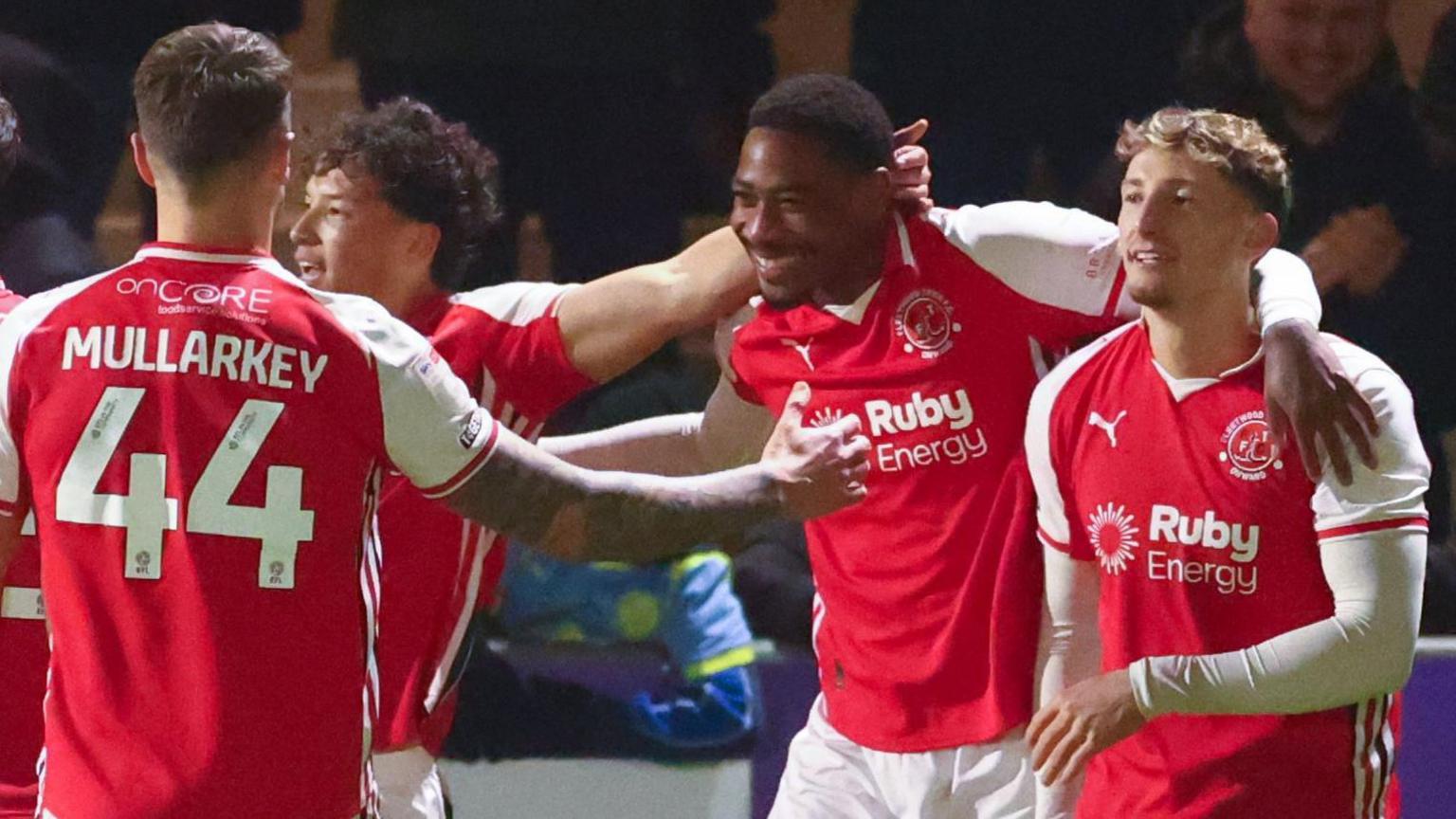 Zech Medley is congratulated by his teammates after scoring against Gillingham
