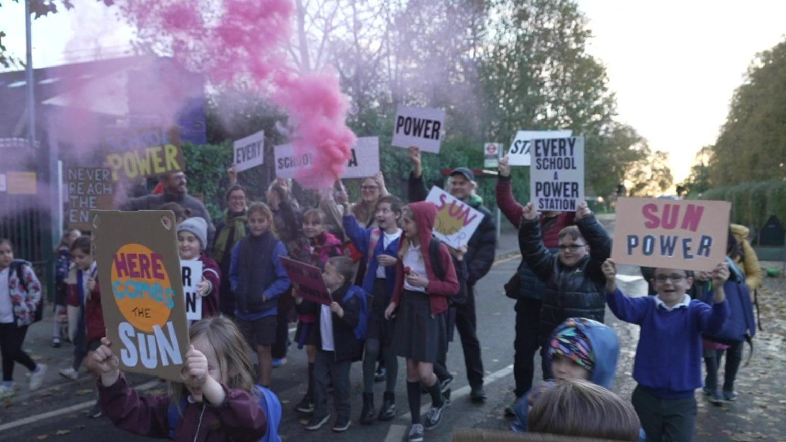 Children outside Barn Croft Primary School on the day solar panels were installed