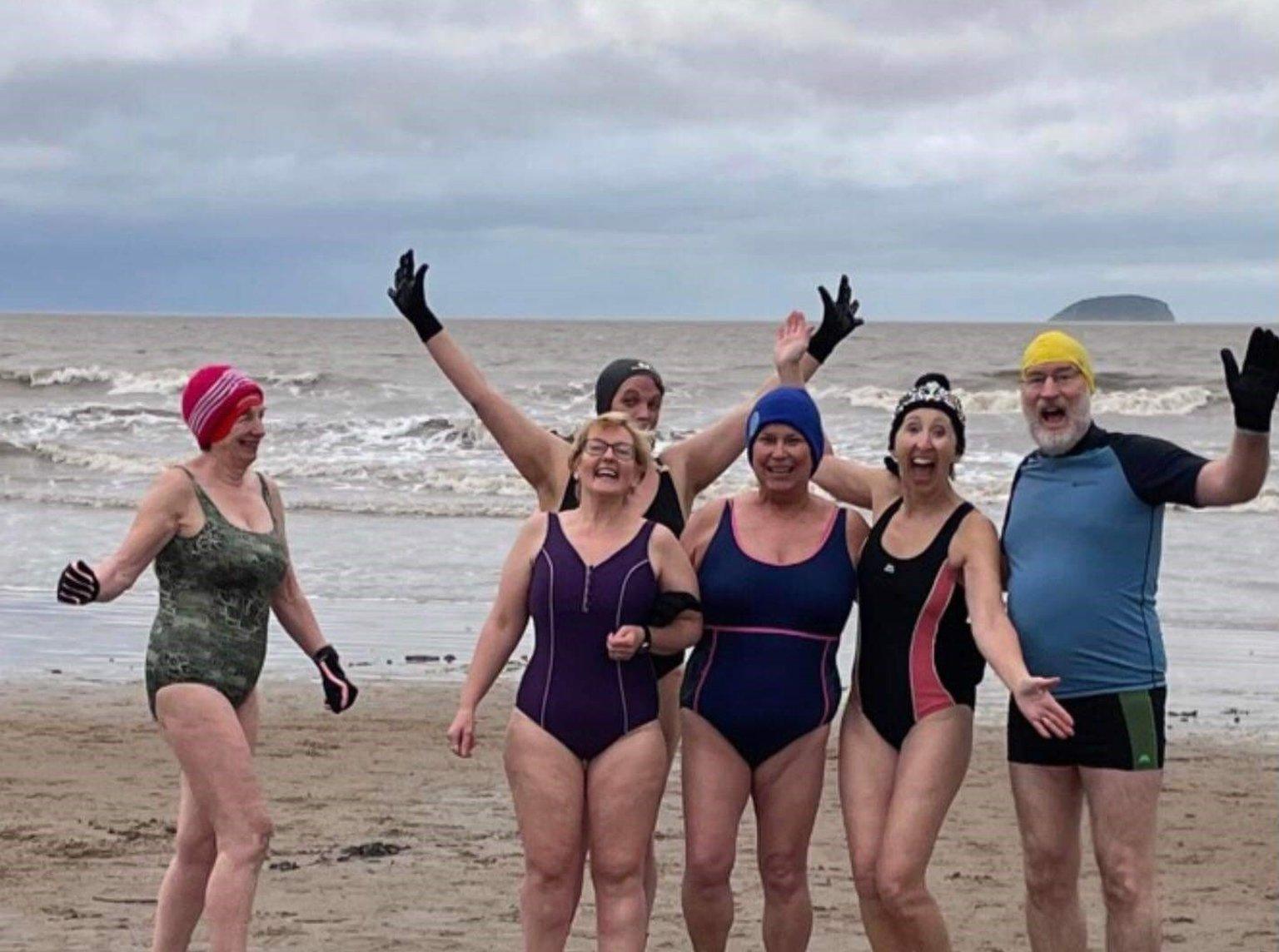 Sea swimmers on the beach at Weston-Super-Mare