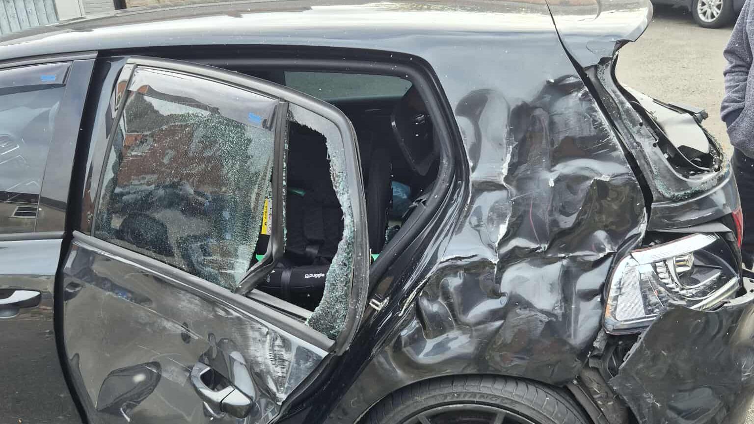 Black Volkswagen Golf after crash