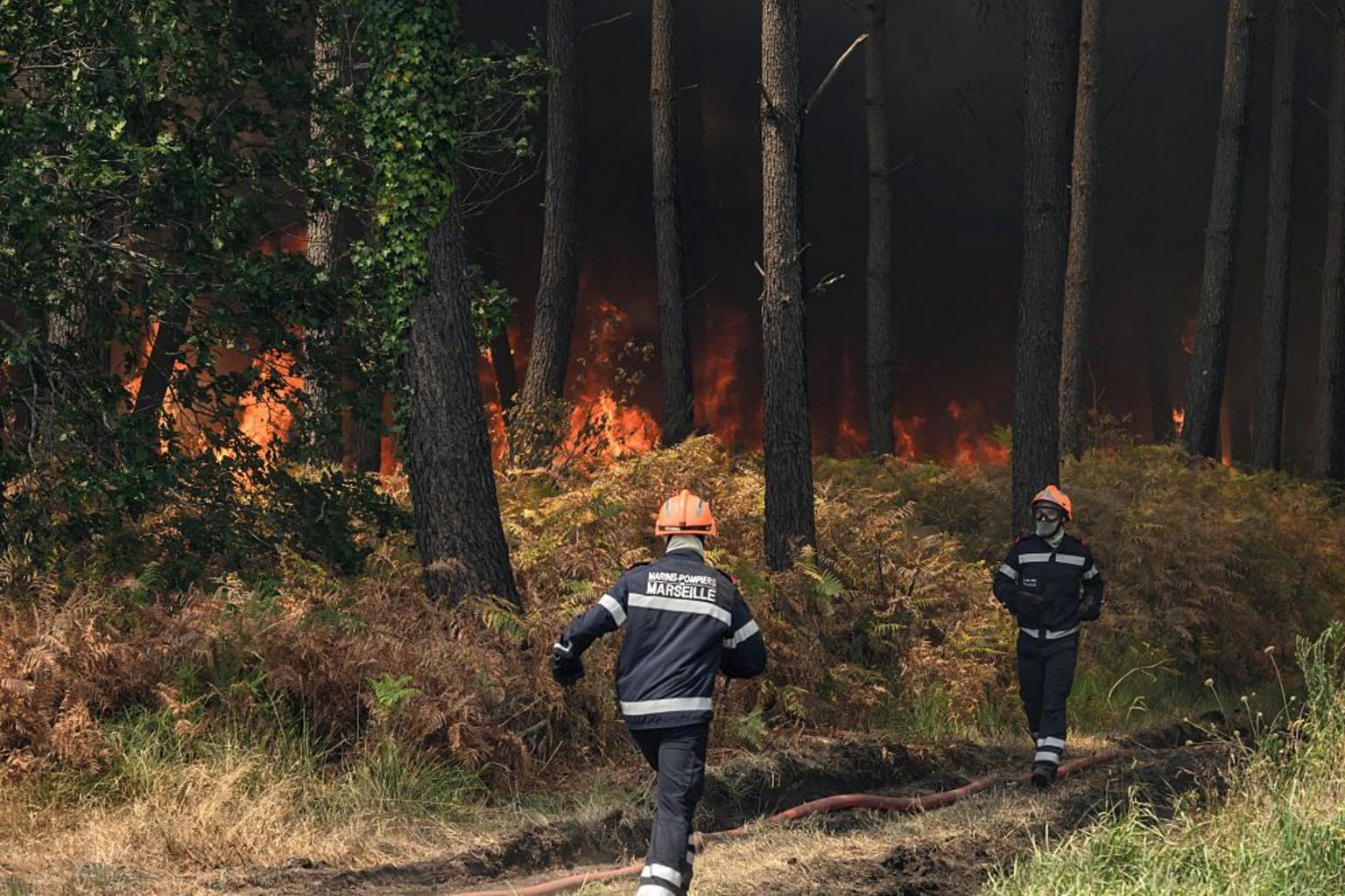 France fire crews face searing heat in battle to contain flames