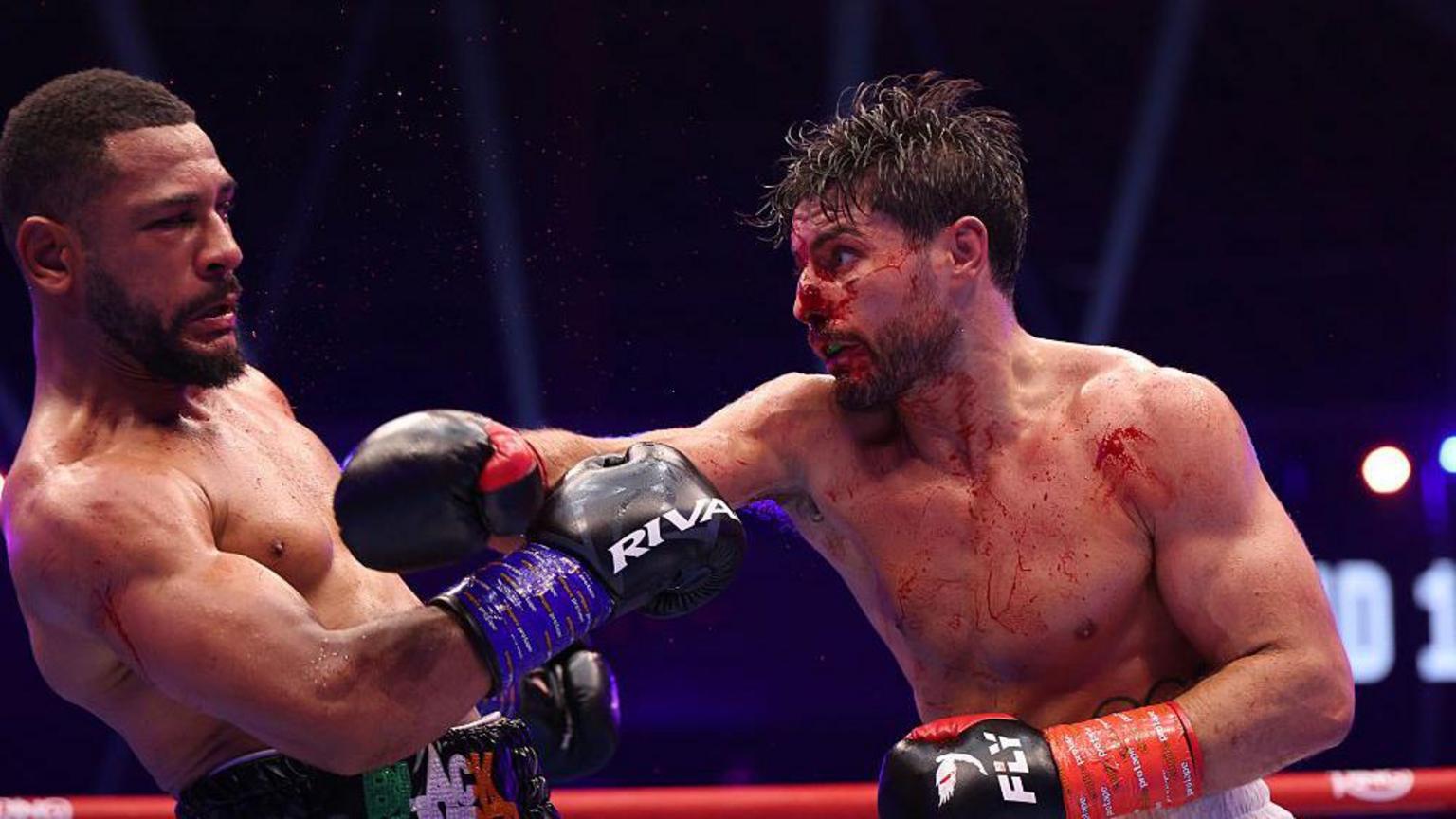 Bloodied Kelly battles past Agyarko to retain title