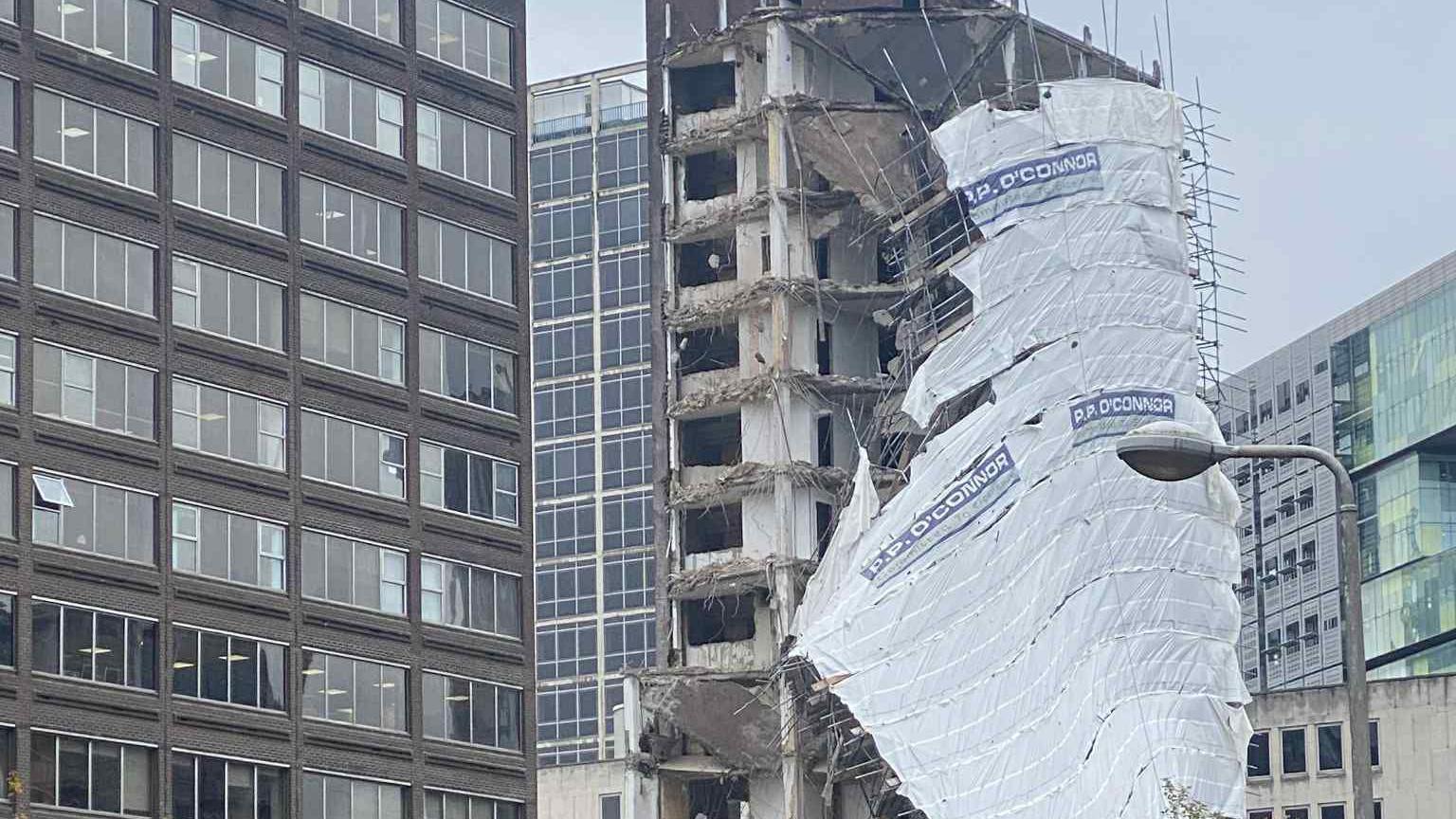Grey building with scaffolding around it