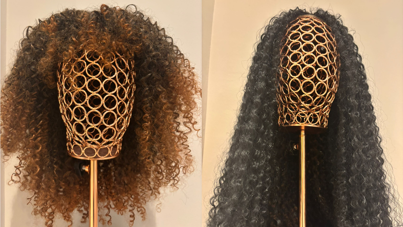 There are two wigs, each on a head-shaped display stand. The one on the left is ginger and dark brown, with shoulder-length curls and a fringe. The one on the right is long, black curls from a centre-parting.