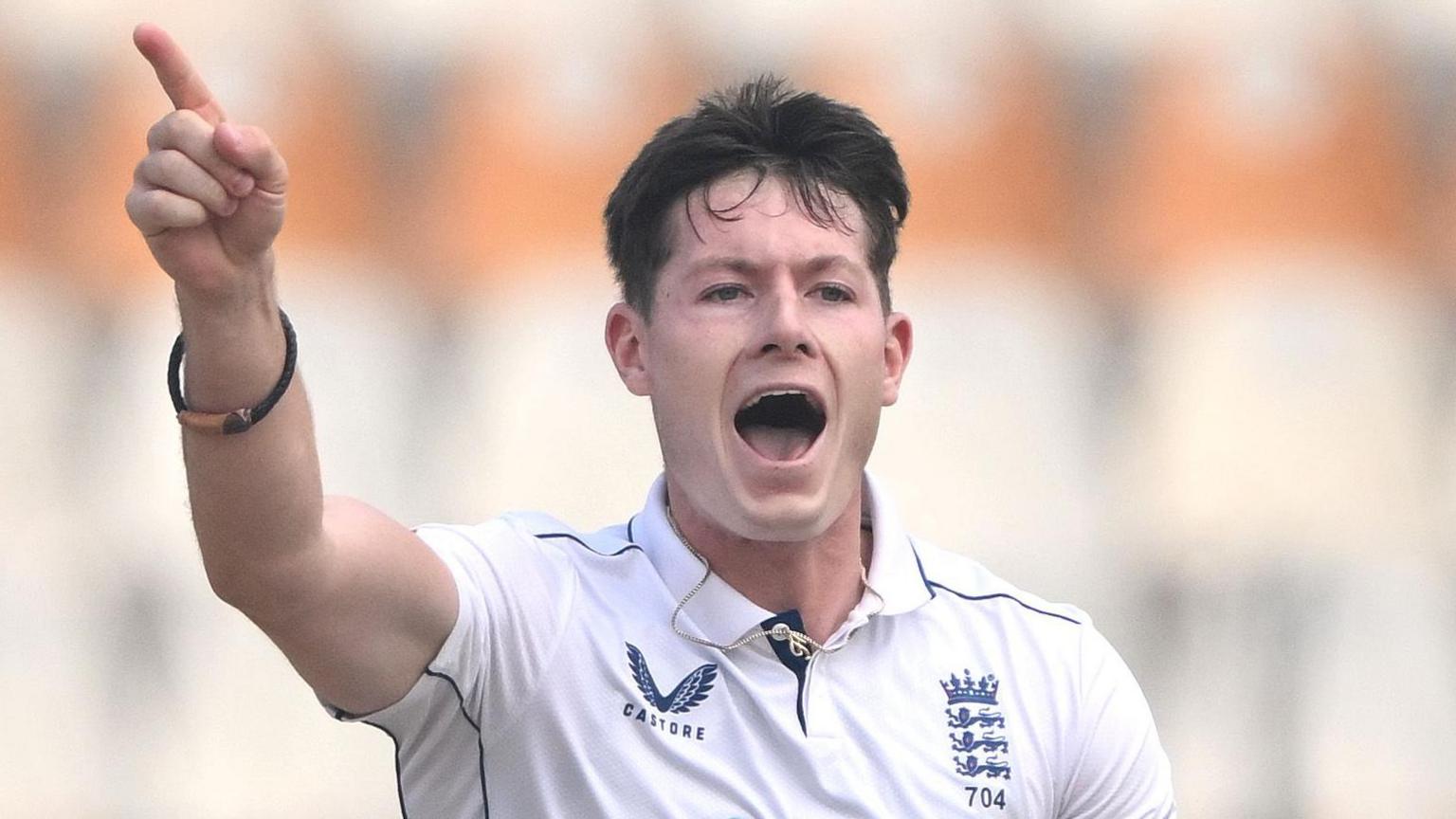 Matthew Potts celebrates taking a wicket for England