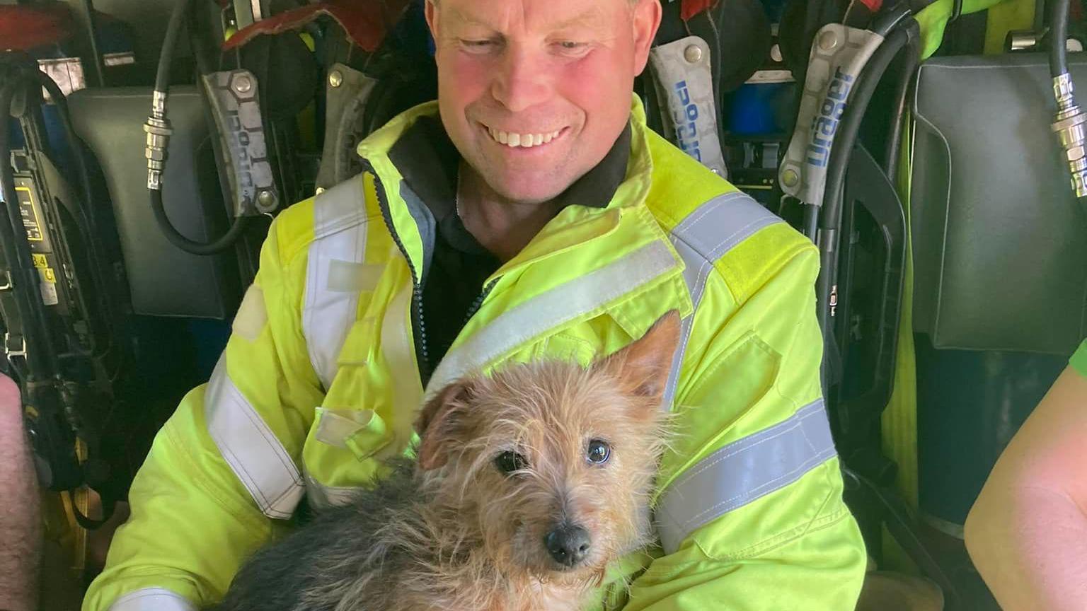 James Trouson with the dog in the fire engine