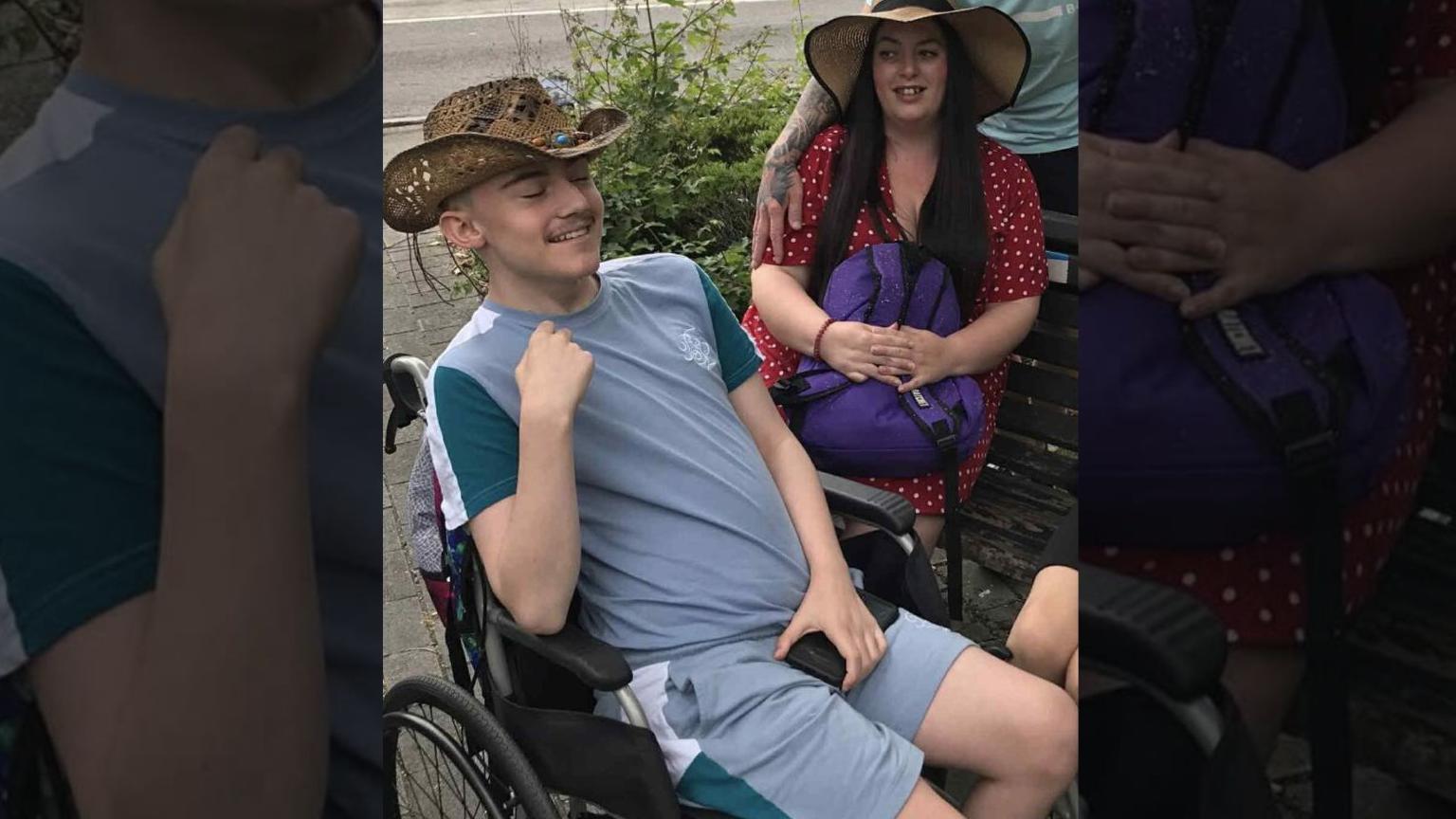 Image shows a 16-year-old boy sitting in a wheelchair