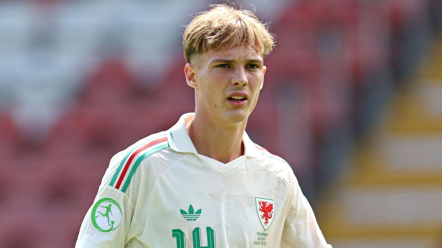 Joe Lacey in action for Wales