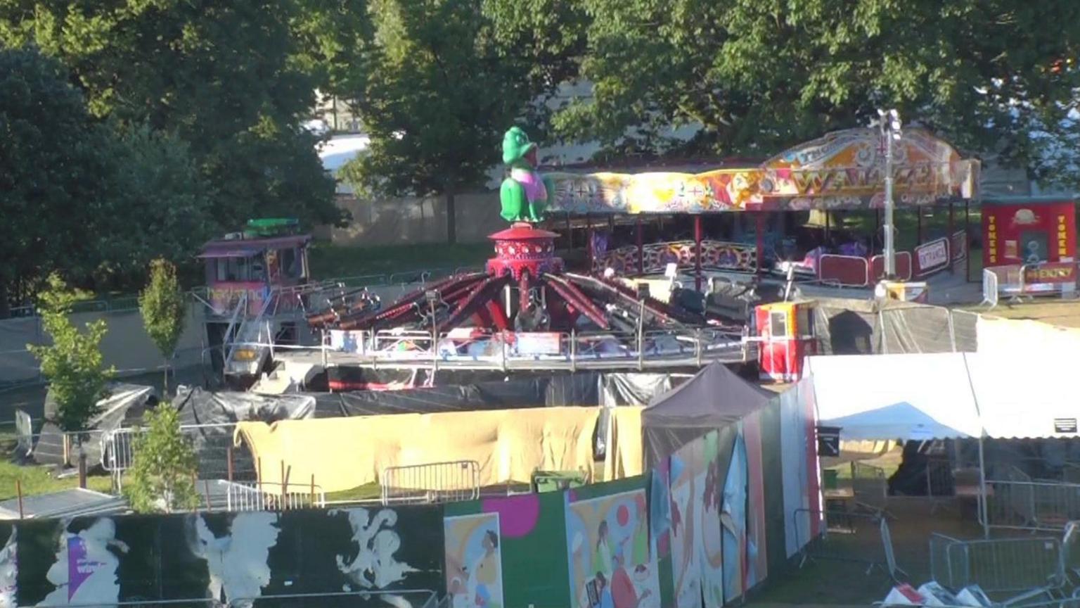 Tarpaulin seen around one funfair rides