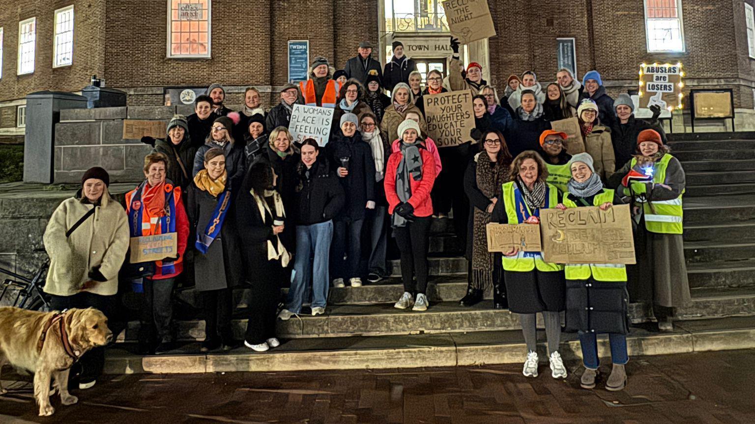 Dozens of people gathered on Tunbridge Wells town hall steps, holding women's safety banners. 