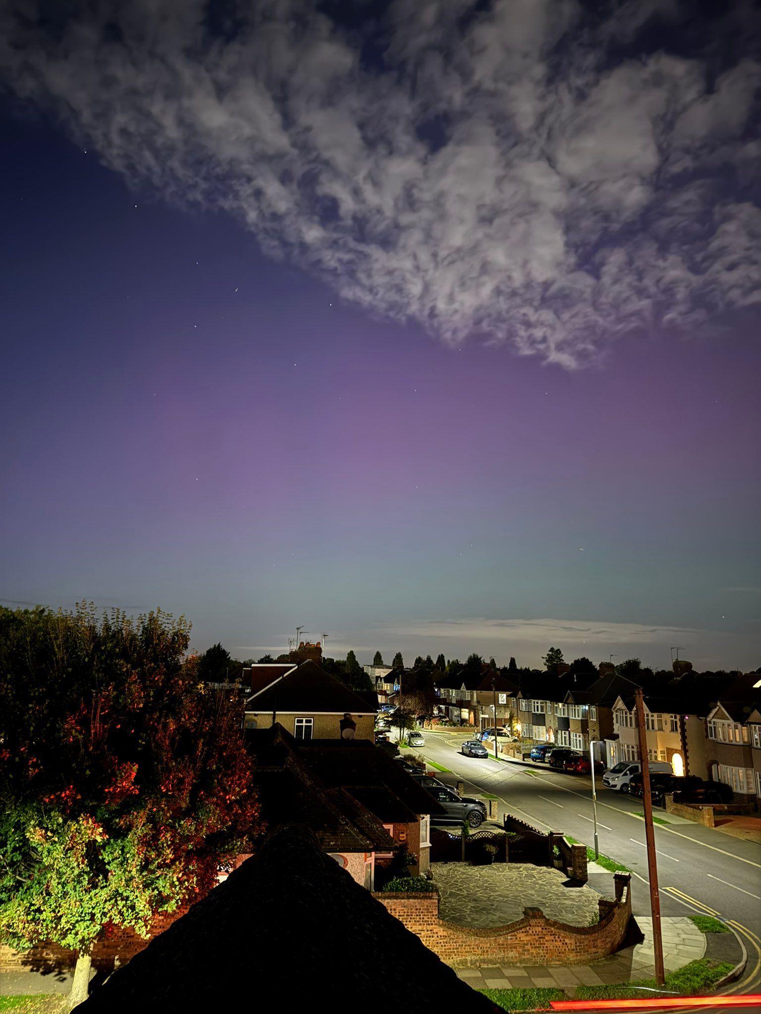 A splash of colour illuminates the night sky about a residential street in London on Thursday night