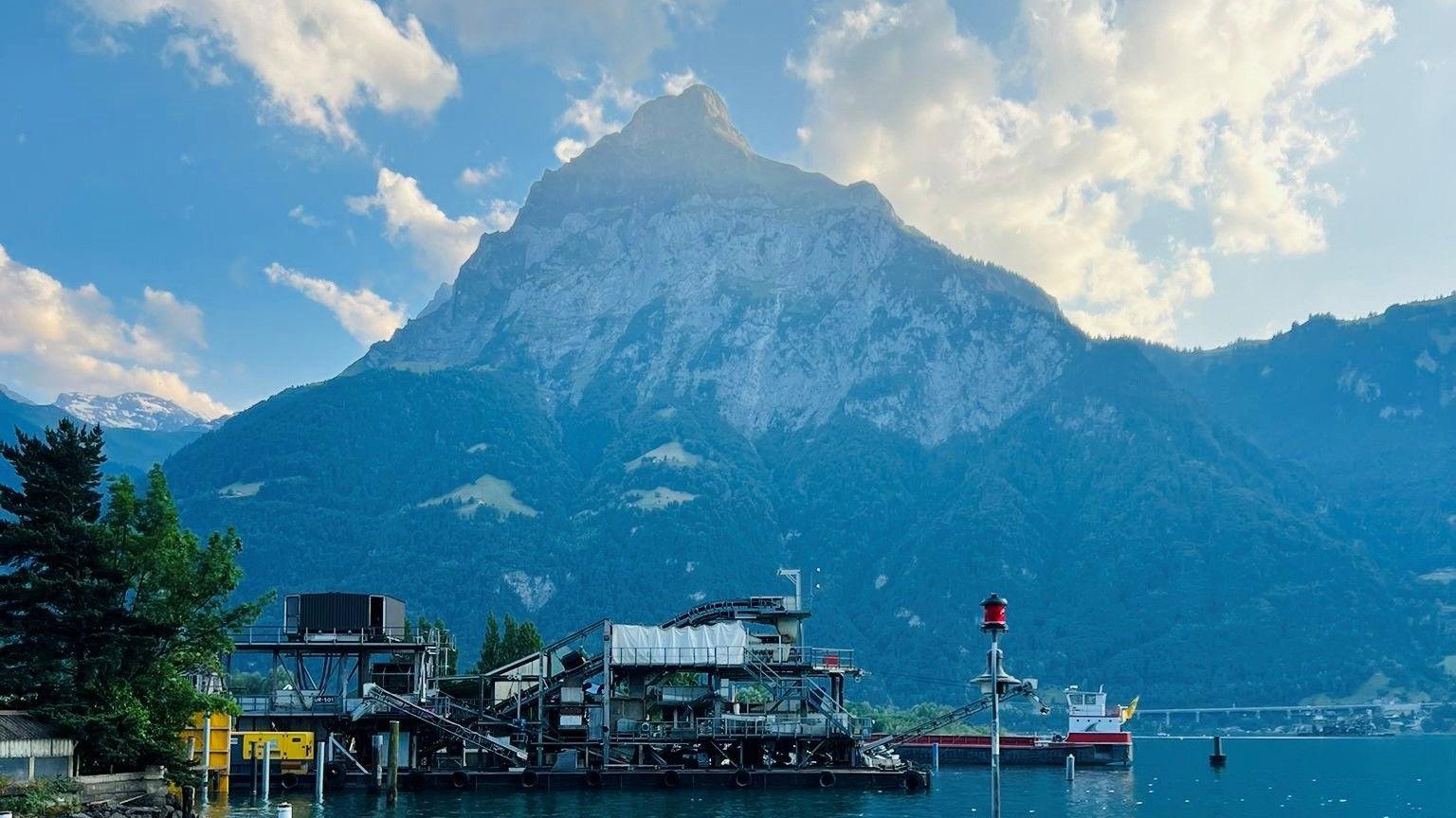 Mountain - Gitschen mountain - in Switzerland, with water in the foreground.