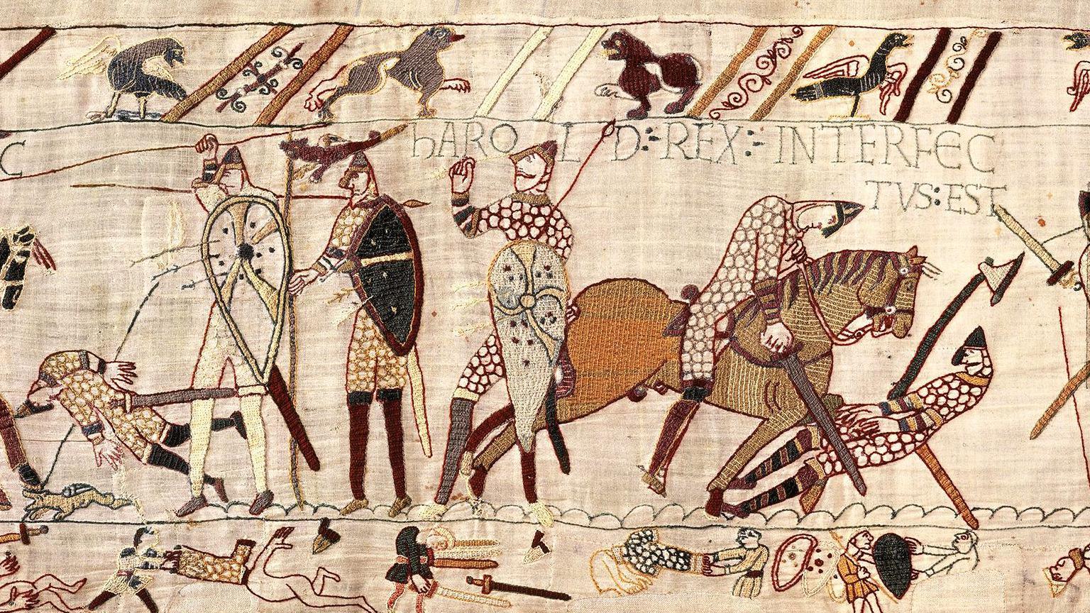 A wide crop shows the battlefield scene where Harold is depicted as being shot with an arrow surrounded by horses and knights, with birds and medieval writing reading 'Harold rex interfectvsest' with fabric detail showing the number 57.