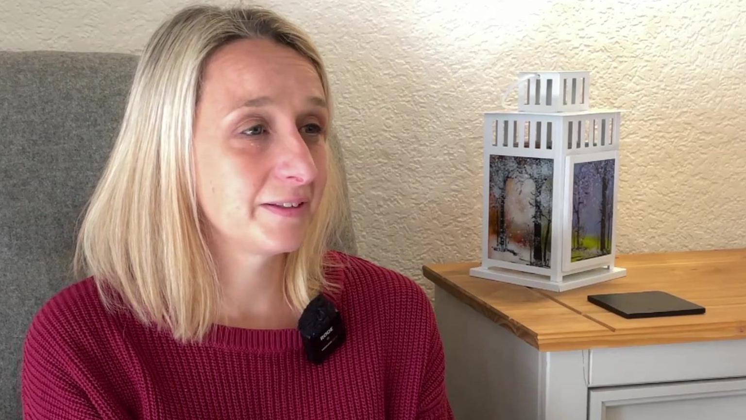 Jess Hartley sitting down during the TV interview, looking at the camera